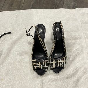 Black and white open toe pumps